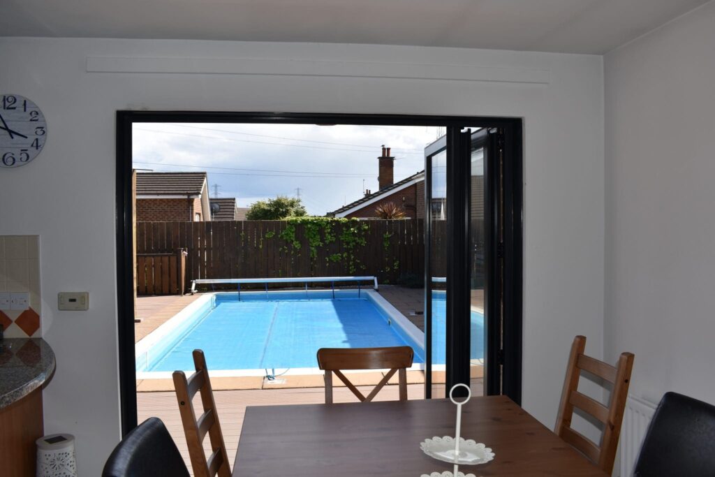 Bifolding doors with knockout building work completed in Lisburn by Budget Designer HomeWorks