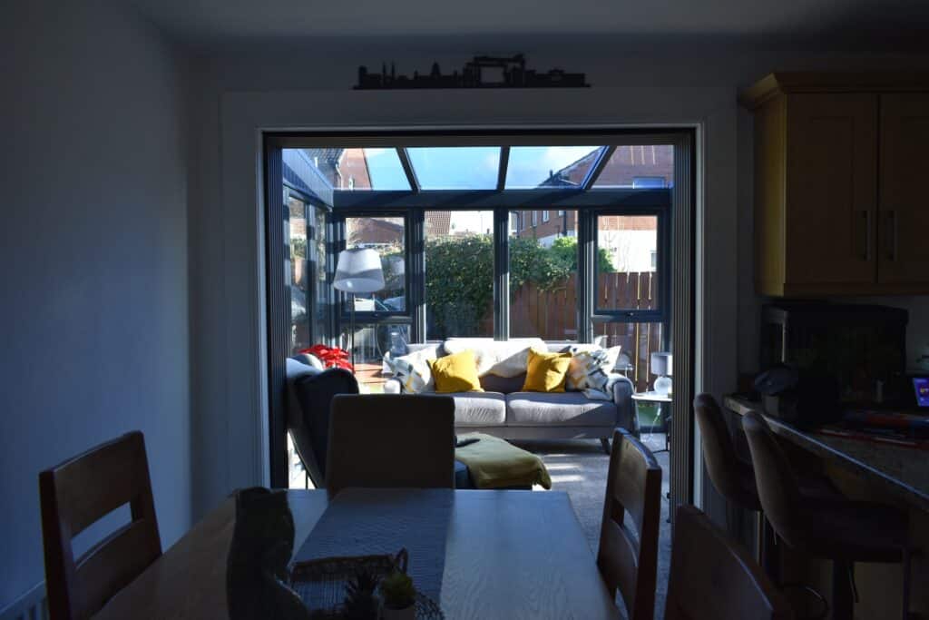 Open plan conservatory extension finished in anthracite grey in Bangor NI