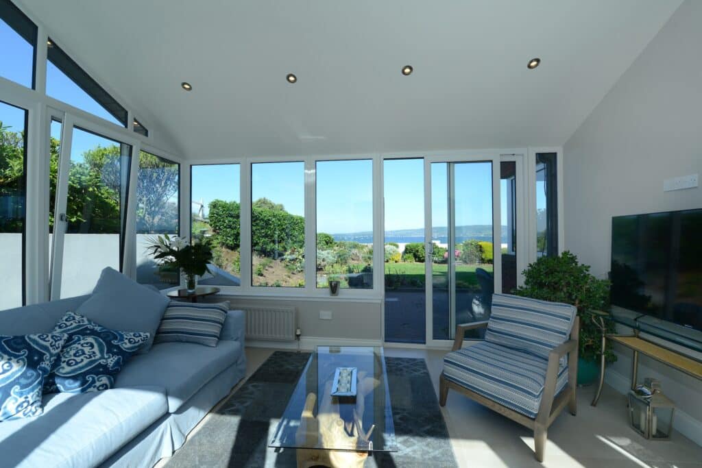 Inside Sunroom With Tilt & Turn Windows and matching sliding patio doors in Cultra