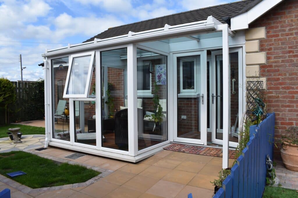 White Lean To Conservatory With open Porch built on the Ards Peninsula by Budget Designer HomeWorks