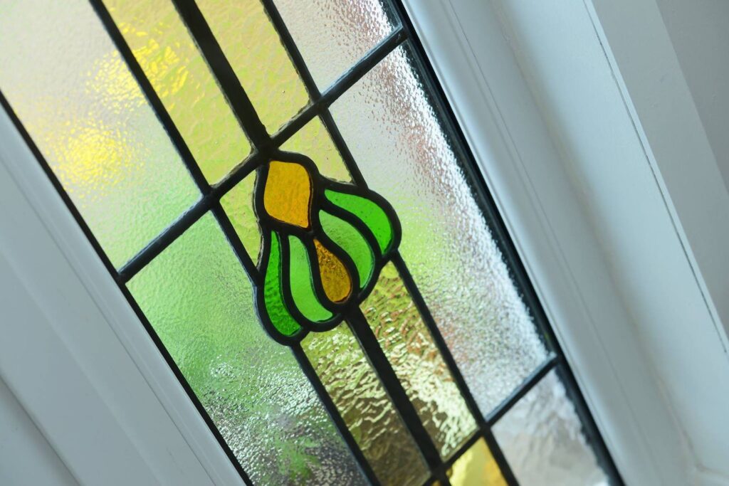 Old stained glass installed into new door