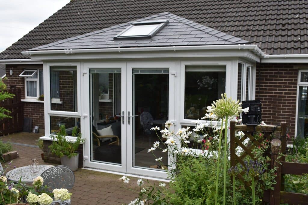 Sunroom Conversion with a tiled roof and roof light in Comber