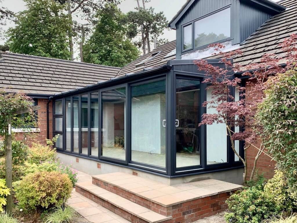 Double sliding patio doors in new conservatory by Budget Designer HomeWorks