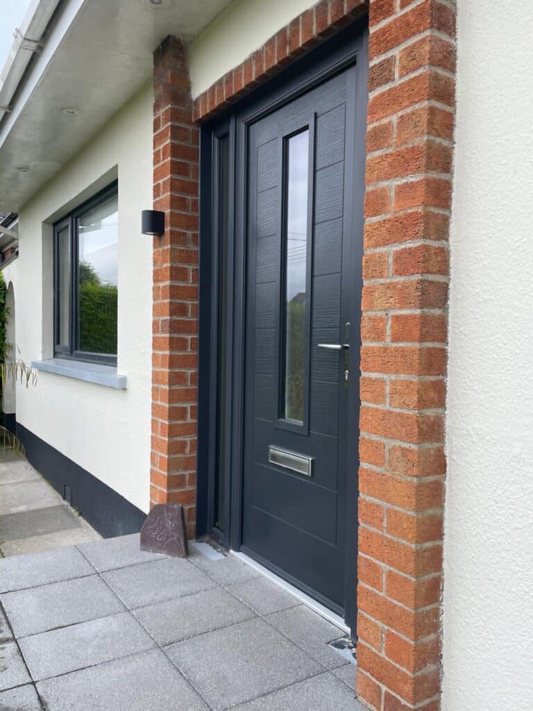 Modern composite front door with side light designed and fitted by Budget Designer HomeWorks