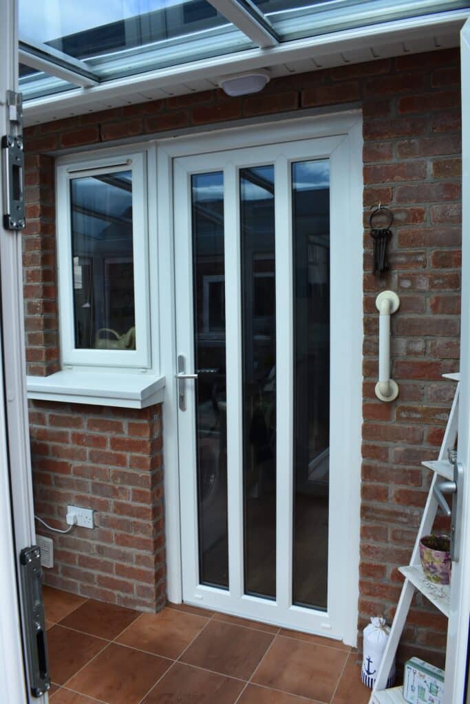 White uPVC Back Door designed and installed in Cloughey by Budget Desginer HomeWorks